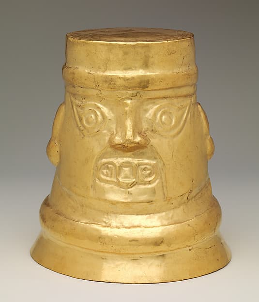 Beaker with inverse faces, by Lambayeque (Sicán) artist(s)