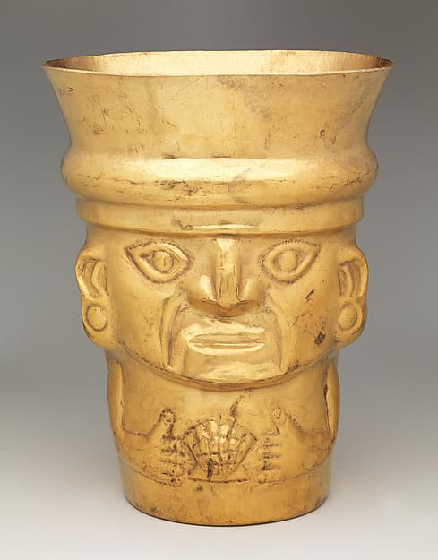 Beaker with figure and Spondylus shell, by Lambayeque (Sicán) artist(s)