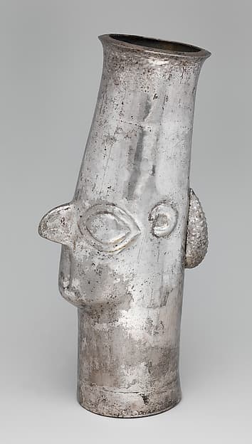 Beaker with face, by Inca artist(s)