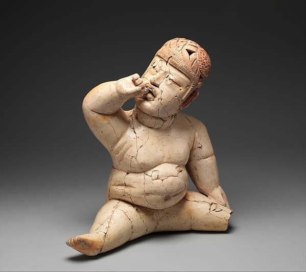 Seated hollow figure with helmet, by Las Bocas artist(s)