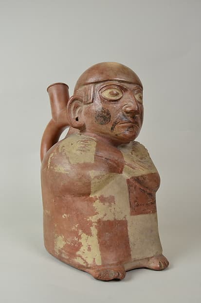 Stirrup Spout Bottle with Seated Figure