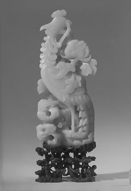 Figure of a Phoenix Standing amid Carved Foliage with Peony Motifs