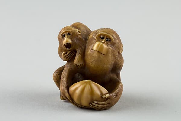 Netsuke of a Female Monkey Holding a Nut while her Baby Crawls on her Back, by Masatami