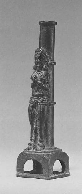 Female Worshipper in Front of a Column Support