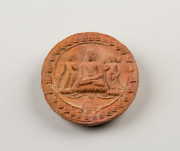 Molded Plaque with Seated Buddha and Attendant Bodhisattvas