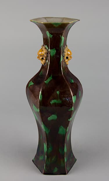 Hexagonal vase with lion-head handles
