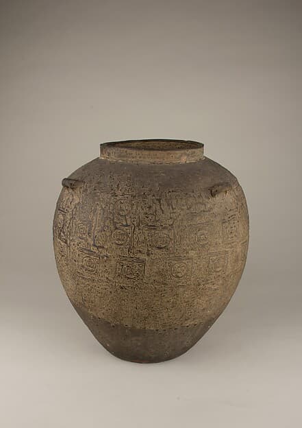 Jar with coin pattern