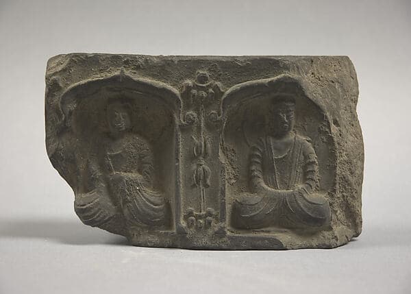Tile with Buddhist images