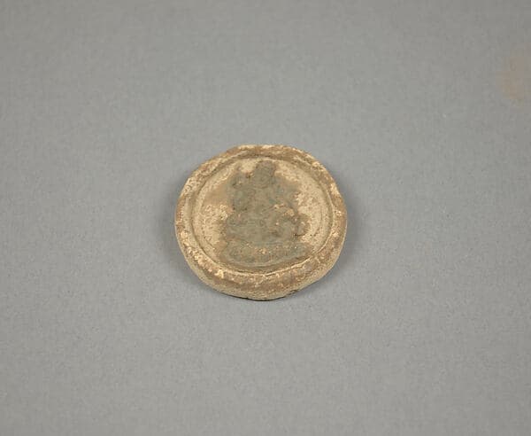Votive Plaque with Seated Figure