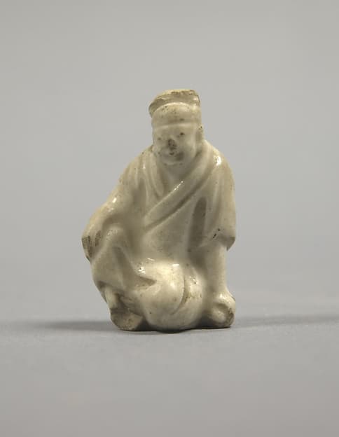 Figure of a seated man