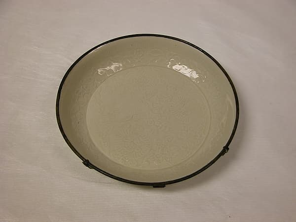 Dish with lion among floral sprays