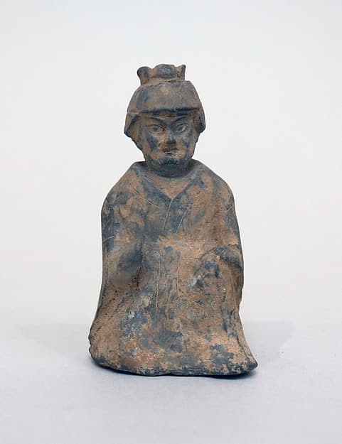 Figure of a seated man