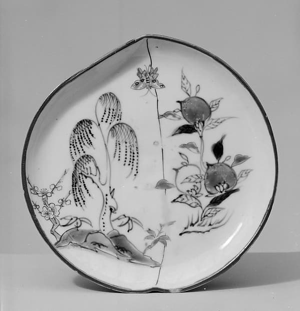 Peach-shaped dish with trees and peaches