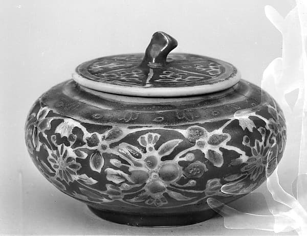 Covered jar with floral pattern