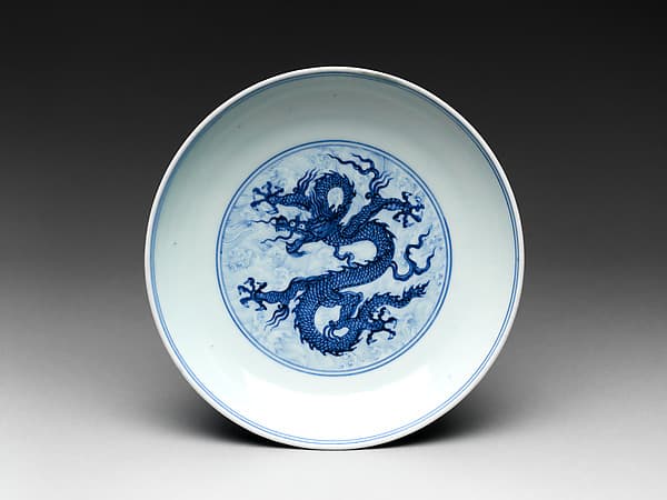 Dish with dragon amid waves