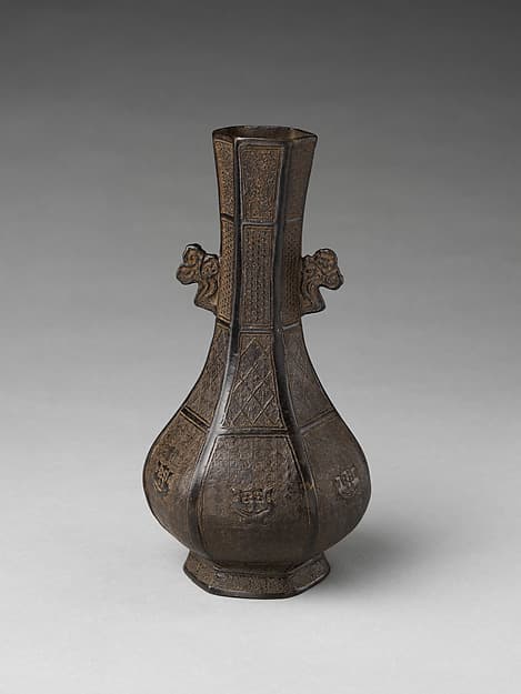 Hexagonal vase with cloud-shaped handles