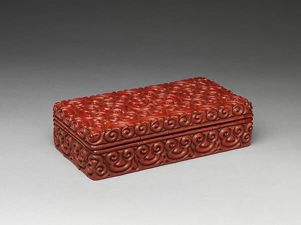 Rectangular box with pommel scrolls