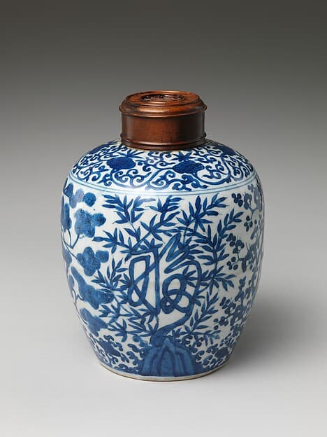 Jar decorated with auspicious characters amid plants