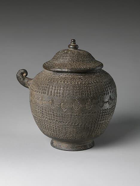 Covered urn with geometric decoration