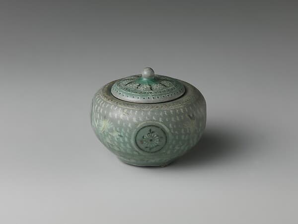 Small jar and cover decorated with chrysanthemums, cranes, and clouds