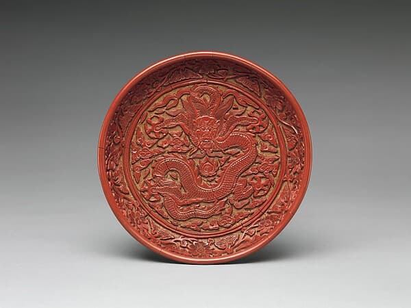 Dish with a dragon amid clouds