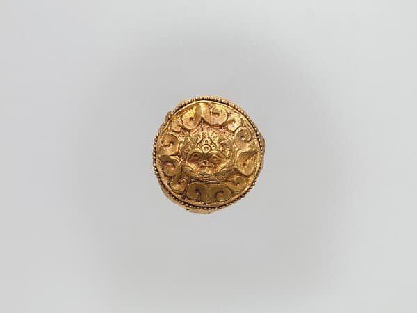 Cap-Shaped Plaque with Lion