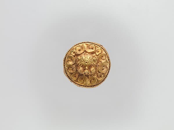 Cap-Shaped Plaque with Lion