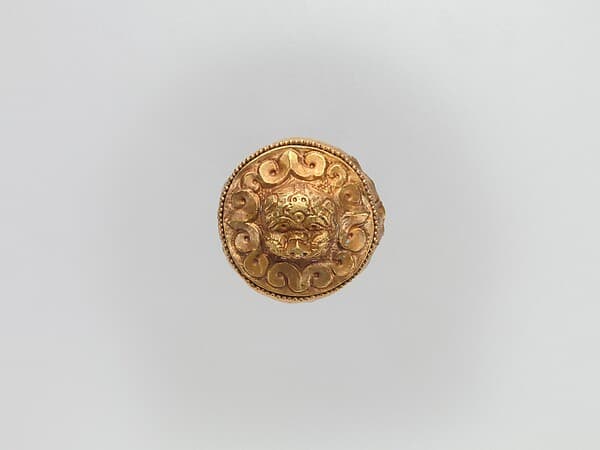 Cap-Shaped Plaque with Lion