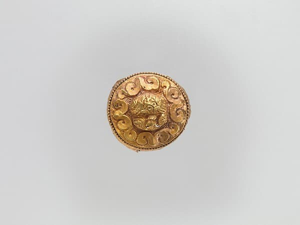 Cap-Shaped Plaque with Lion