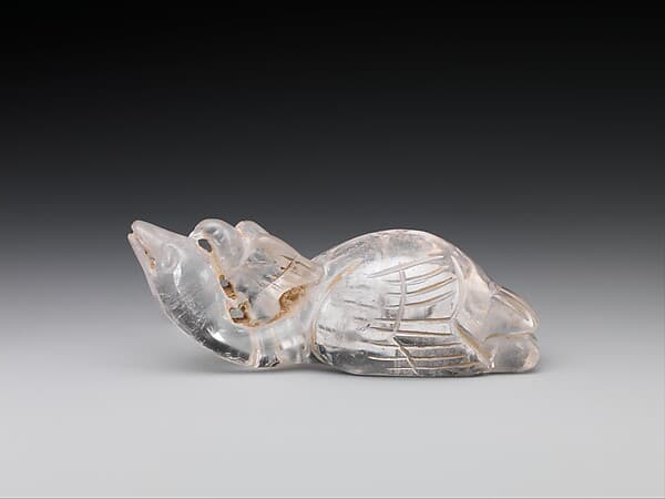 Toggle in the shape of a falcon attacking a swan