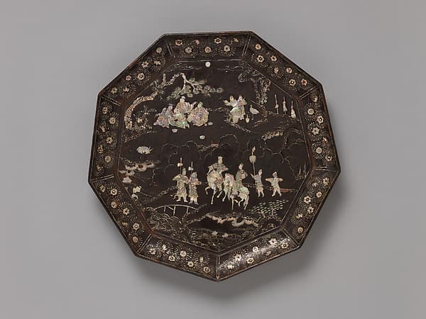 Tray with figures in a landscape