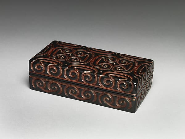 Box with pommel scroll design
