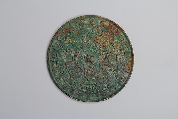 Mirror decorated with lunisolar cosmology