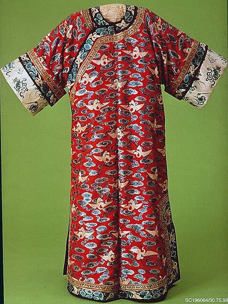 Woman’s robe decorated with cranes amid clouds