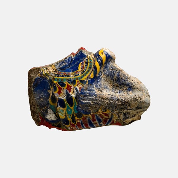 High relief inlay fragment, frontal bust of a god in a feather garment and holding a scepter