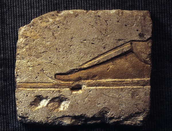 Relief with a royal foot