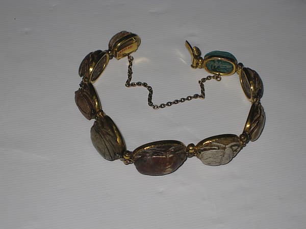 Nine scarabs set in modern bracelet.
