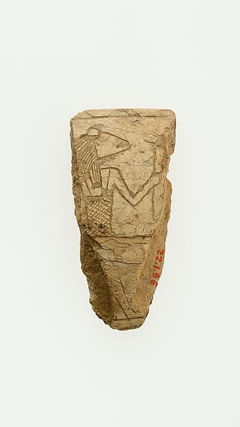 A fragment of a magic wand illustrating a frog headed deity
