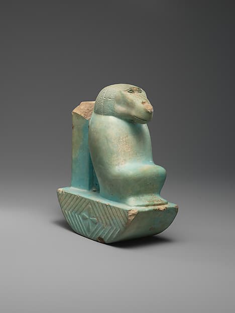 Figure of baboon on a basket and with a pillar (shebet offering)