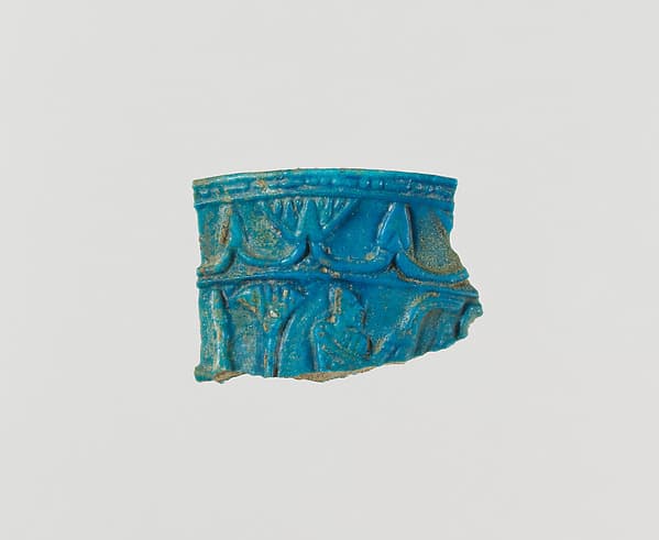 Chalice rim fragment with floral chain and scene of man in papyrus