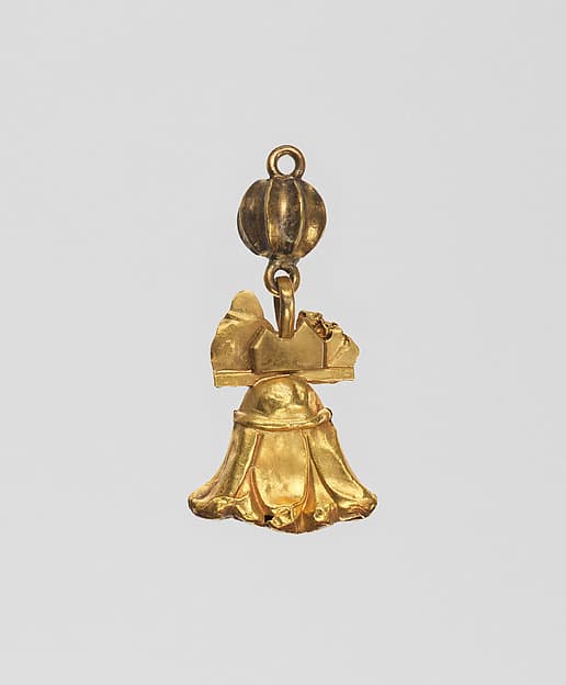 Lotus pendant with two Egyptianizing heads attached, plus a melon bead