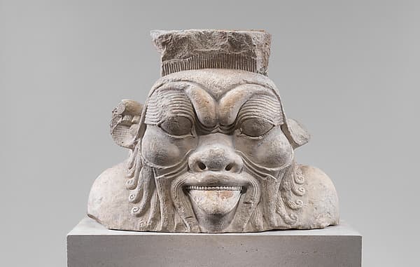 Colossal head from a Bes-image
