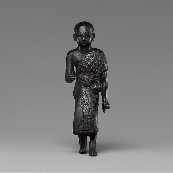 Priest in a leopard skin cloak with an inscription and Osiris on his skirt