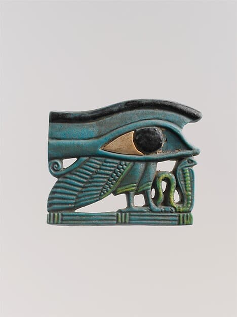 Wedjat eye amulet with a wing and other elements