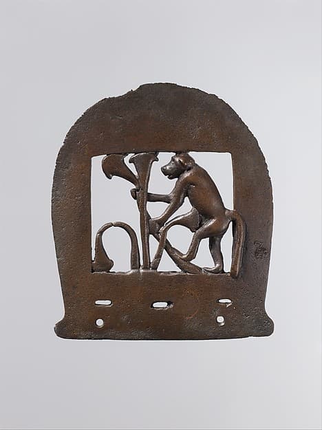 Ax head with monkey figure