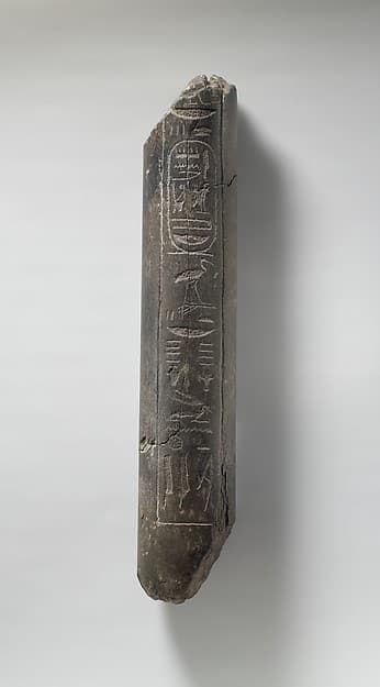 Fragment of a Statue of Haremhab bearing a standard