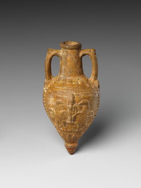 Amphoriskos with molded design of Harpokrates and eagles