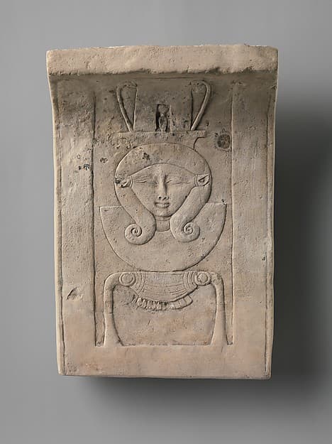 Relief plaque of Hathor emblem, curved as if from a temple frieze