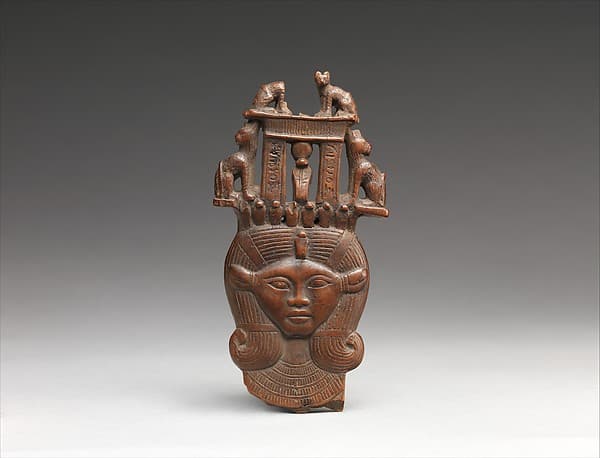 Head of Hathor from a clapper the inscription calling the musician who used it "beloved by the goddess Mut , Lady of Isheru (Karnak)