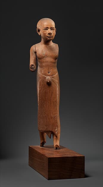 Figure of a Striding Man with a Long Kilt